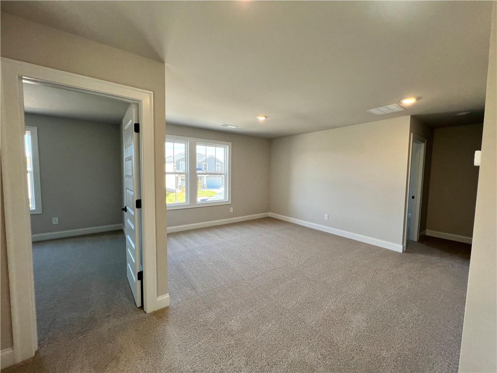 2969 Sweet Red Circle Braselton, GA 30517 - Photo 37 of 49 an empty room with a window and a hallway
