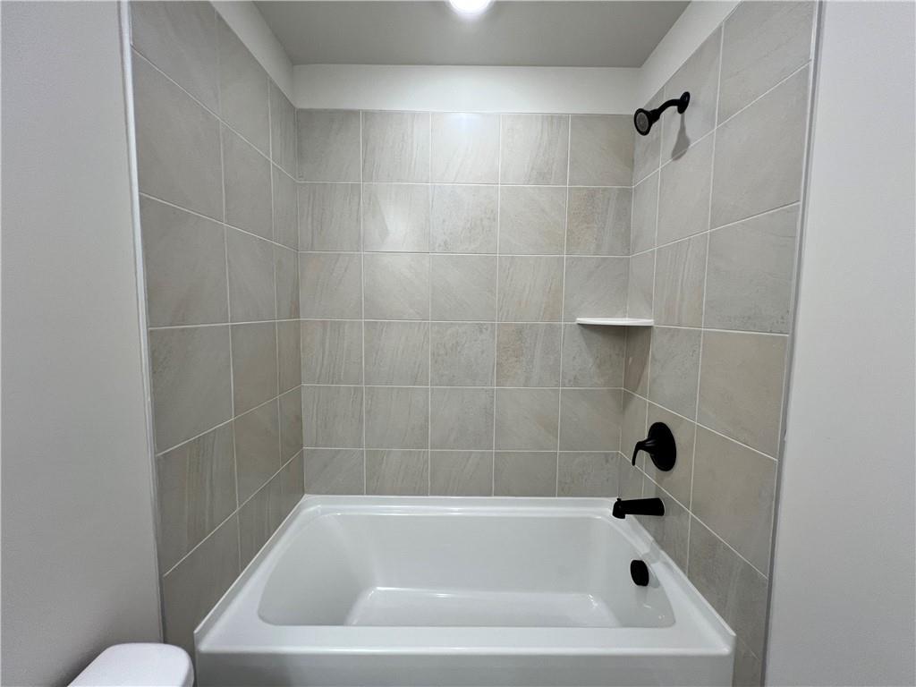 2969 Sweet Red Circle Braselton, GA 30517 - Photo 42 of 49 a bathroom with a bathtub