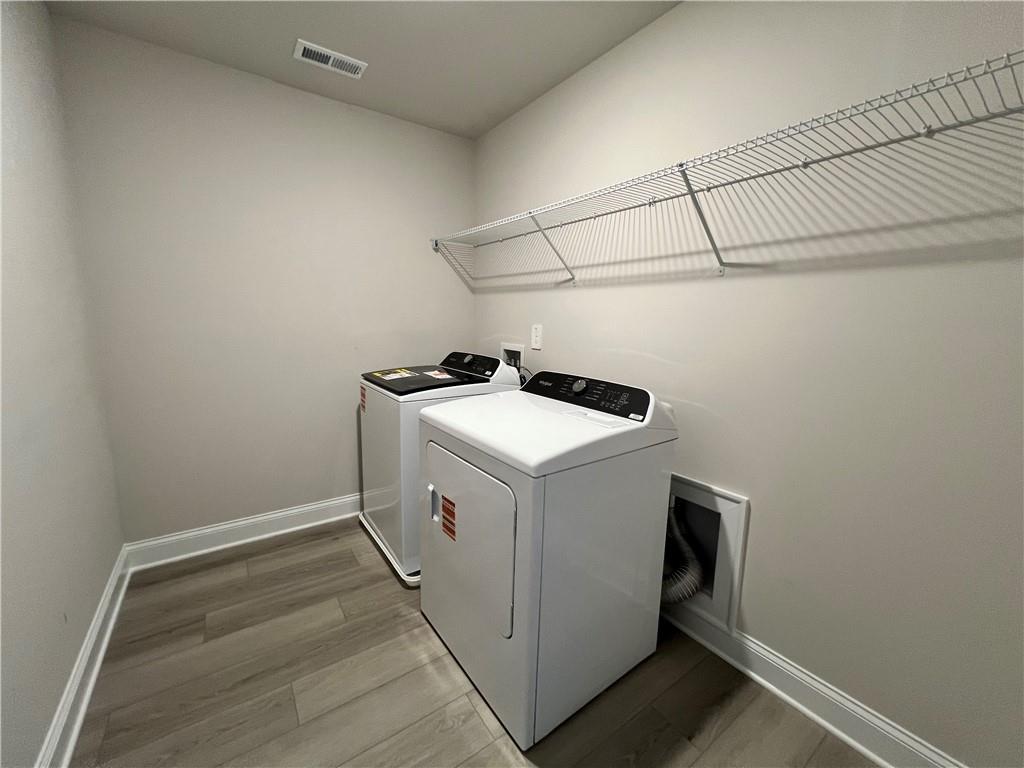 2969 Sweet Red Circle Braselton, GA 30517 - Photo 43 of 49 a utility room with dryer and washer