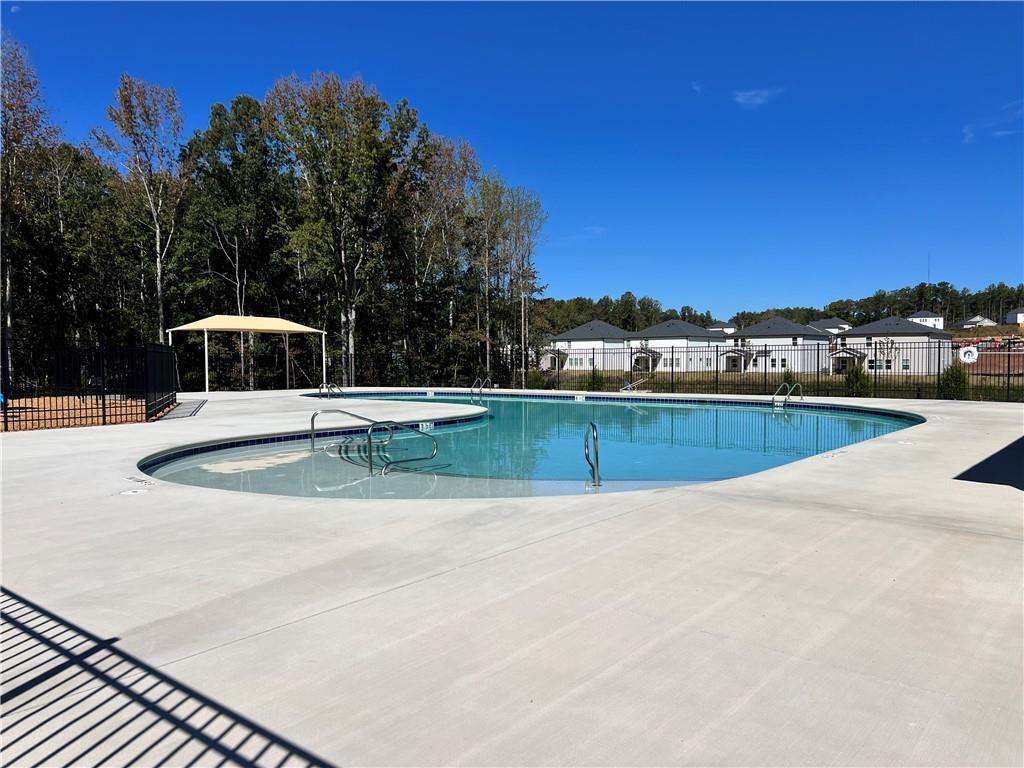 2969 Sweet Red Circle Braselton, GA 30517 - Photo 46 of 49 a view of a swimming pool with a yard
