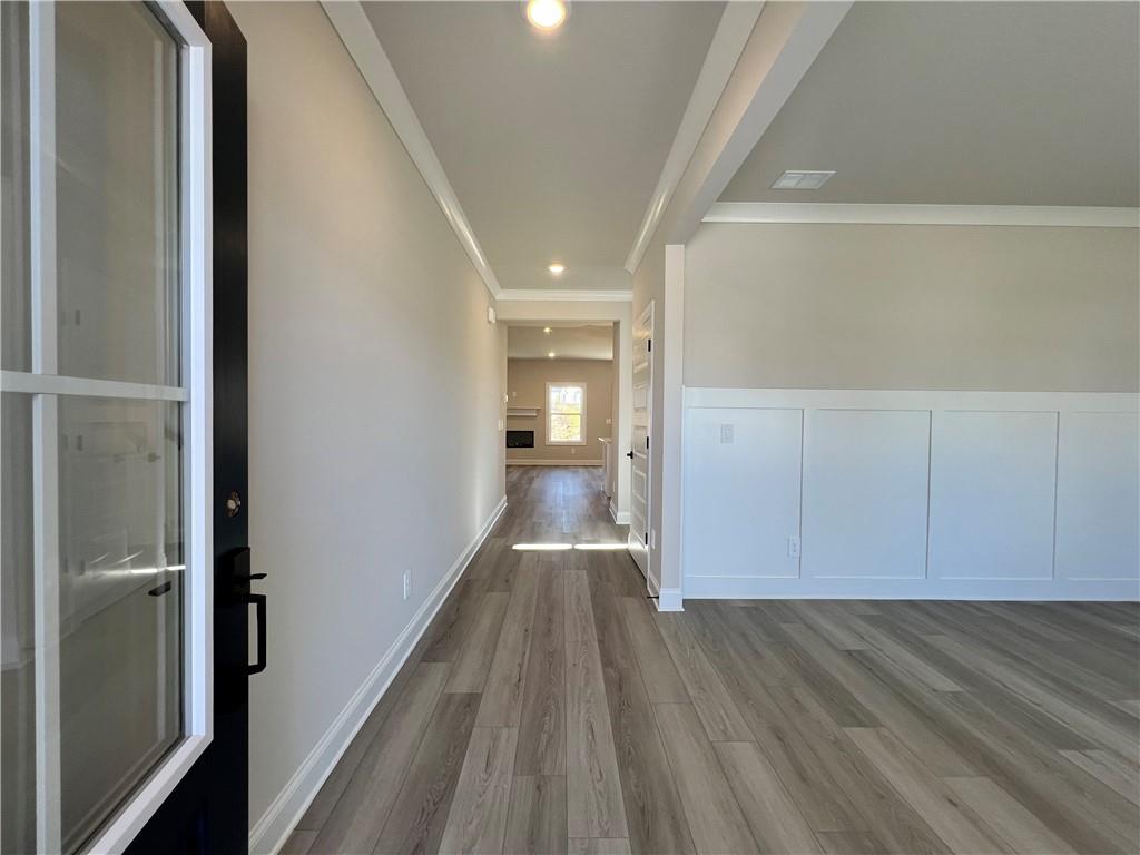 2969 Sweet Red Circle Braselton, GA 30517 - Photo 9 of 49 a view of hallway with wooden floor