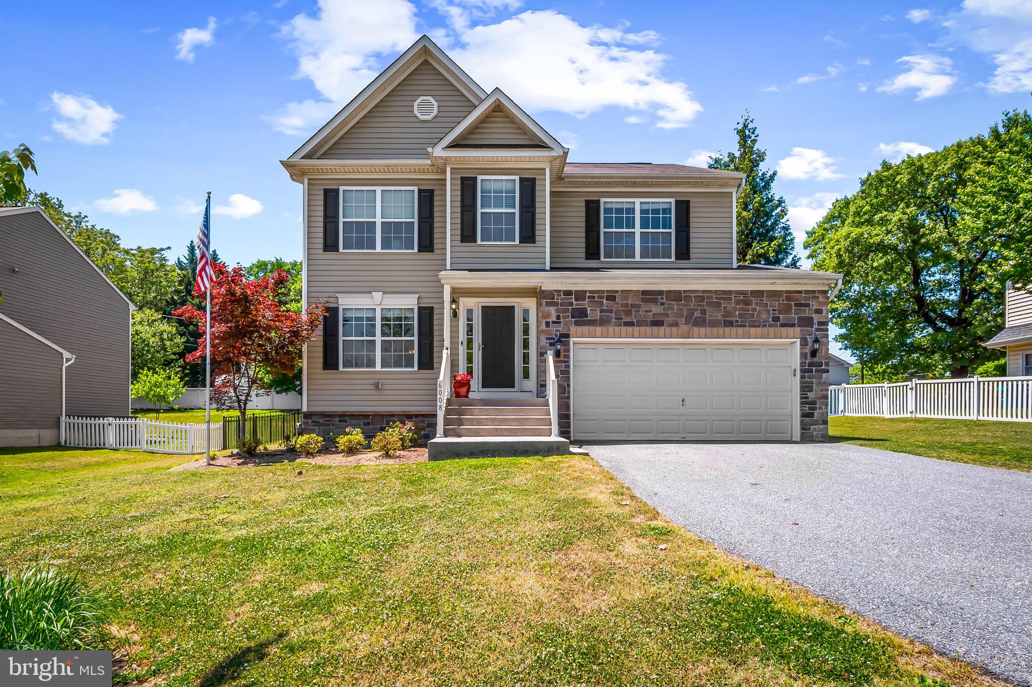 6008 Hanover Road Elkridge, MD 21075 - Photo 1 of 36 a front view of a house with a yard and garage