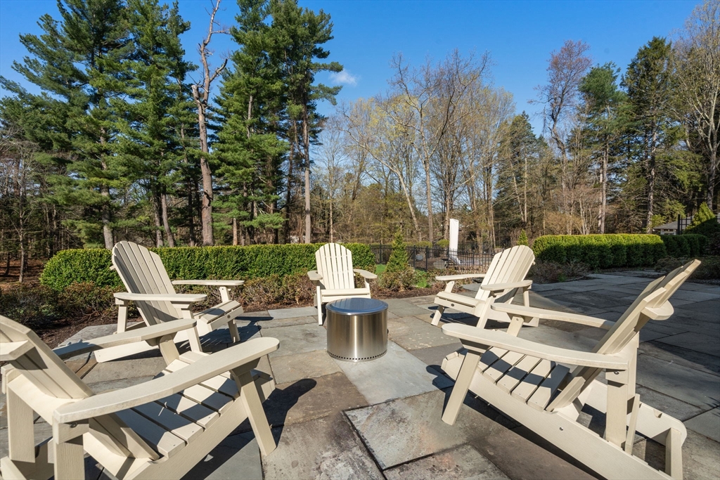 389 Grove Street Needham, MA 02492 - Photo 32 of 40 a view of a patio with chairs and tables