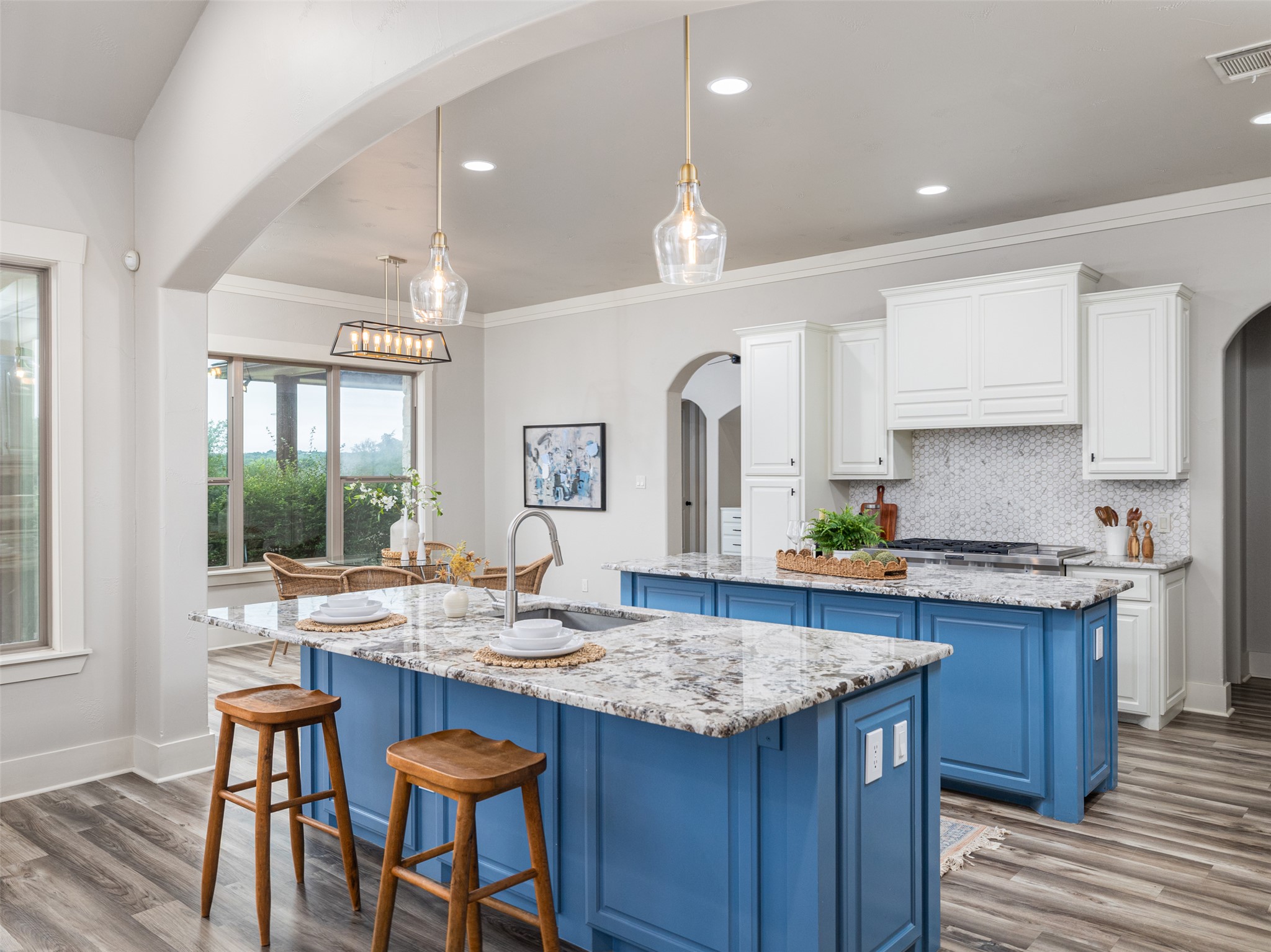 101 Aldea Street Georgetown, TX 78633 - Photo 7 of 40 This well laid out kitchen features updated painted cabinetry with updated granite, backsplash & light fixtures.
