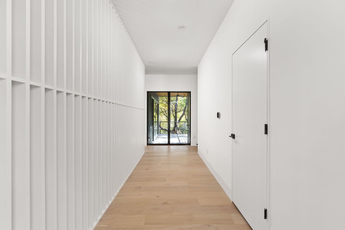 Hall featuring light wood-style flooring