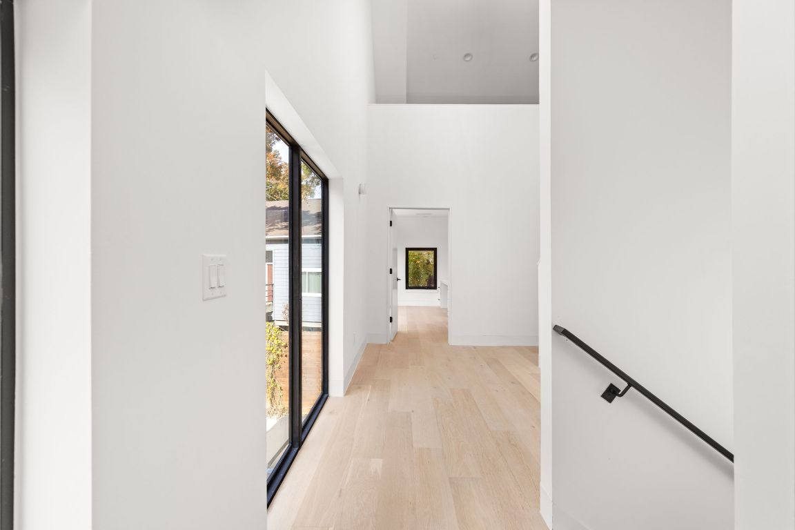 1603 Chelsea Lane, Unit 3 Austin, TX 78704 - Photo 14 of 40 Hall with a towering ceiling and light wood finished floors