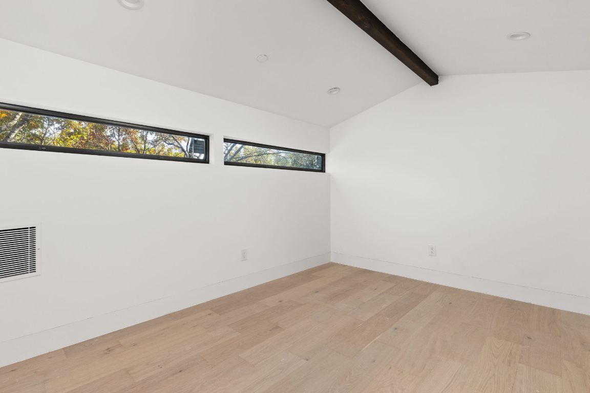 1603 Chelsea Lane, Unit 3 Austin, TX 78704 - Photo 16 of 40 Unfurnished room featuring light wood finished floors and recessed lighting