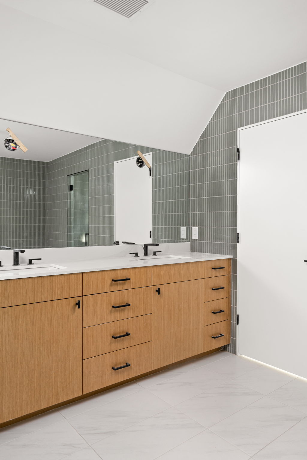 1603 Chelsea Lane, Unit 3 Austin, TX 78704 - Photo 20 of 40 a spacious bathroom with double sink and mirror