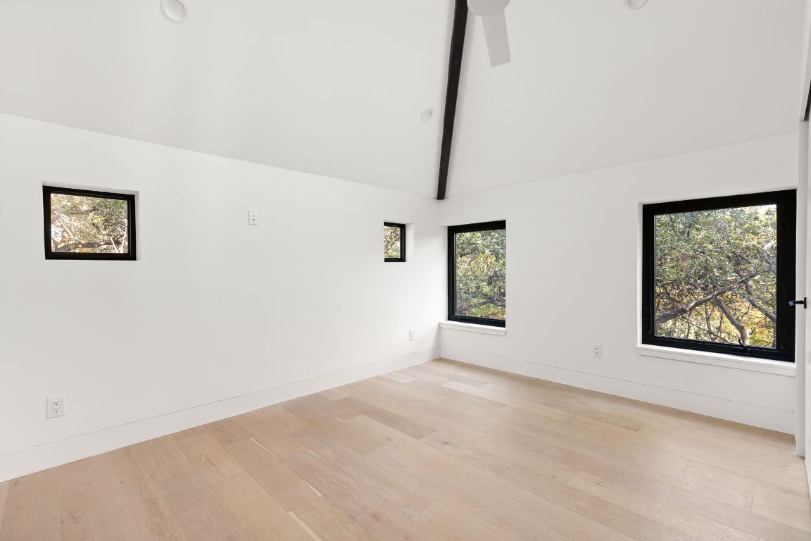 1603 Chelsea Lane, Unit 3 Austin, TX 78704 - Photo 25 of 40 Empty room featuring light wood-style floors and baseboards