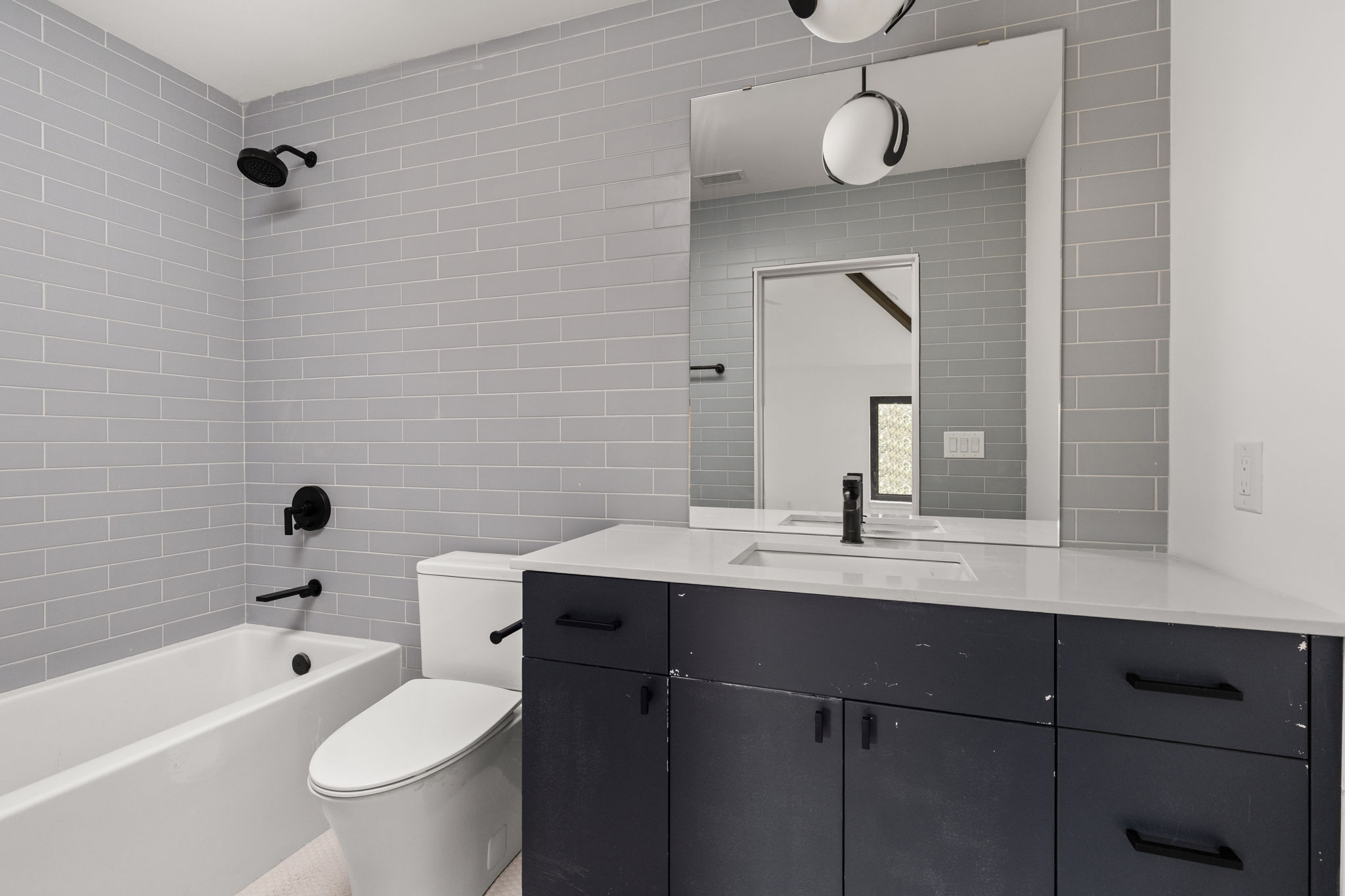1603 Chelsea Lane, Unit 3 Austin, TX 78704 - Photo 28 of 40 a bathroom with a sink a toilet and bathtub