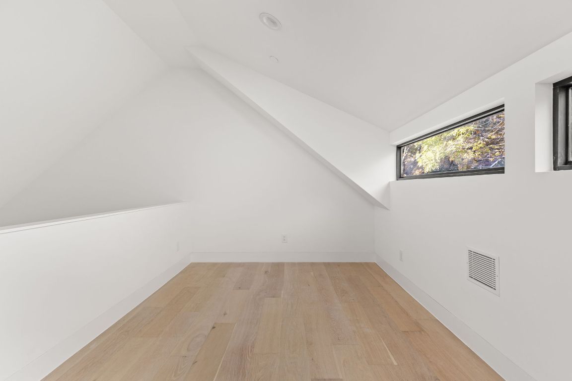 1603 Chelsea Lane, Unit 3 Austin, TX 78704 - Photo 29 of 40 Bonus room featuring light wood-style flooring and vaulted ceiling