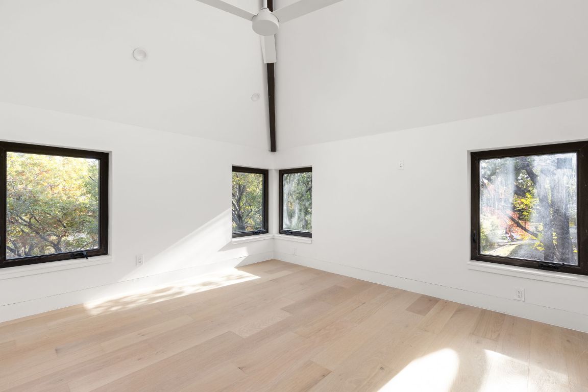1603 Chelsea Lane, Unit 3 Austin, TX 78704 - Photo 29 of 40 Empty room with light wood finished floors and baseboards