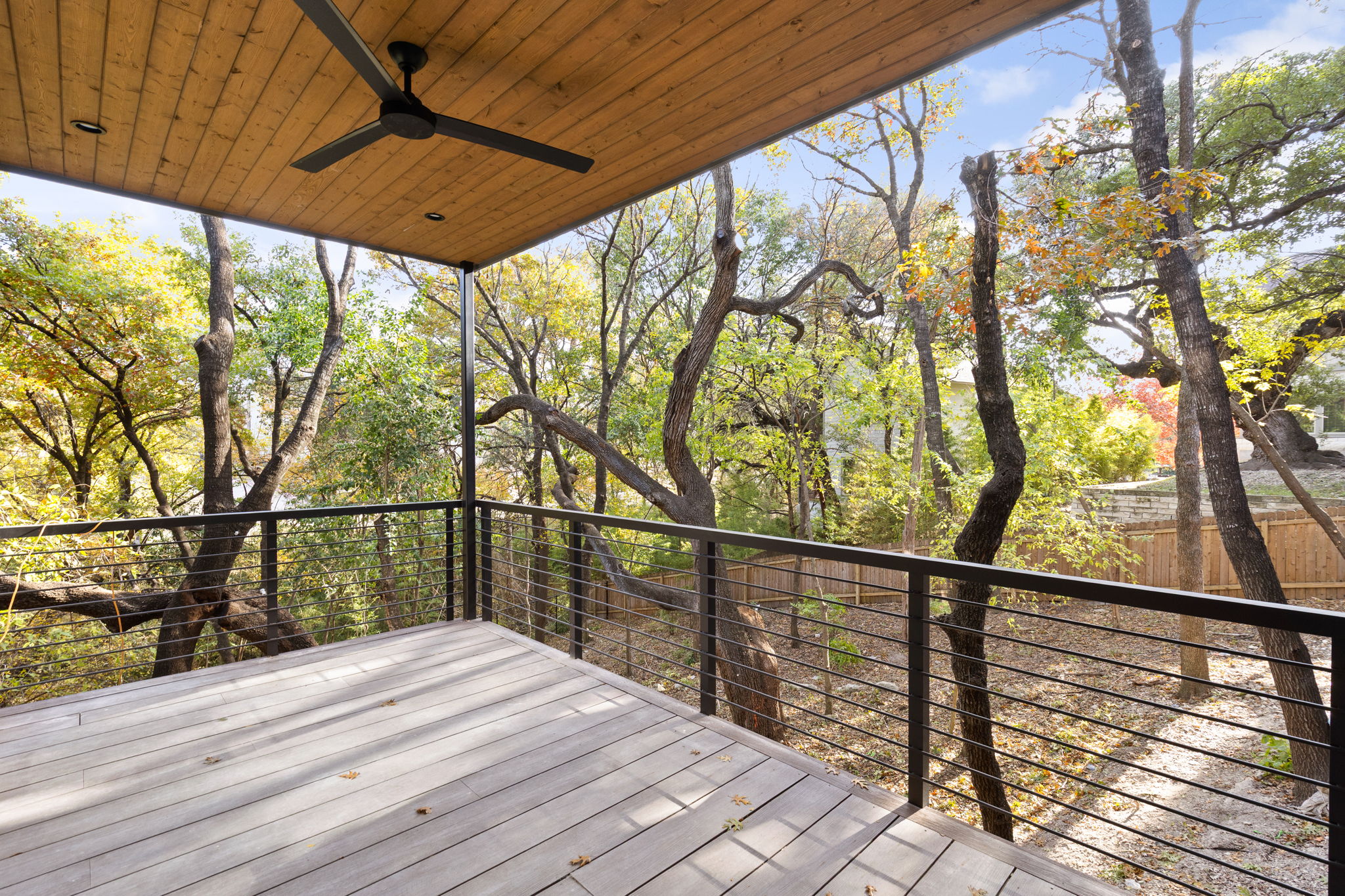 1603 Chelsea Lane, Unit 3 Austin, TX 78704 - Photo 35 of 40 a view of a balcony with wooden floor and fence
