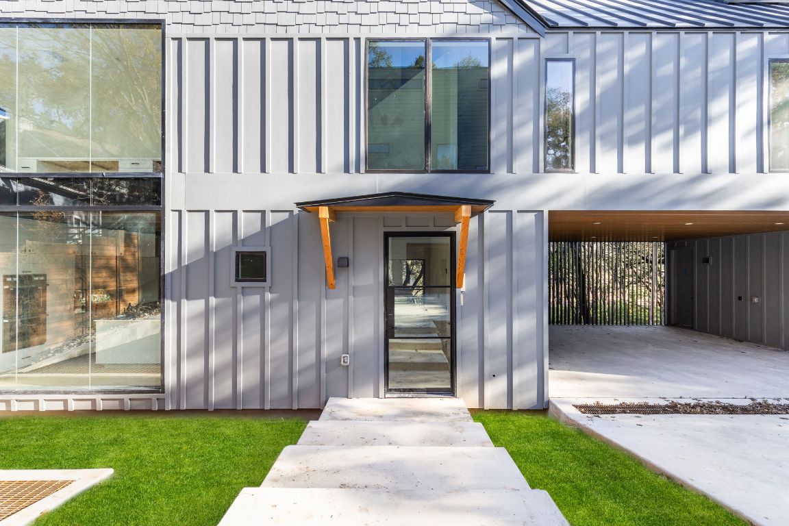 1603 Chelsea Lane, Unit 3 Austin, TX 78704 - Photo 40 of 40 View of exterior entry featuring board and batten siding