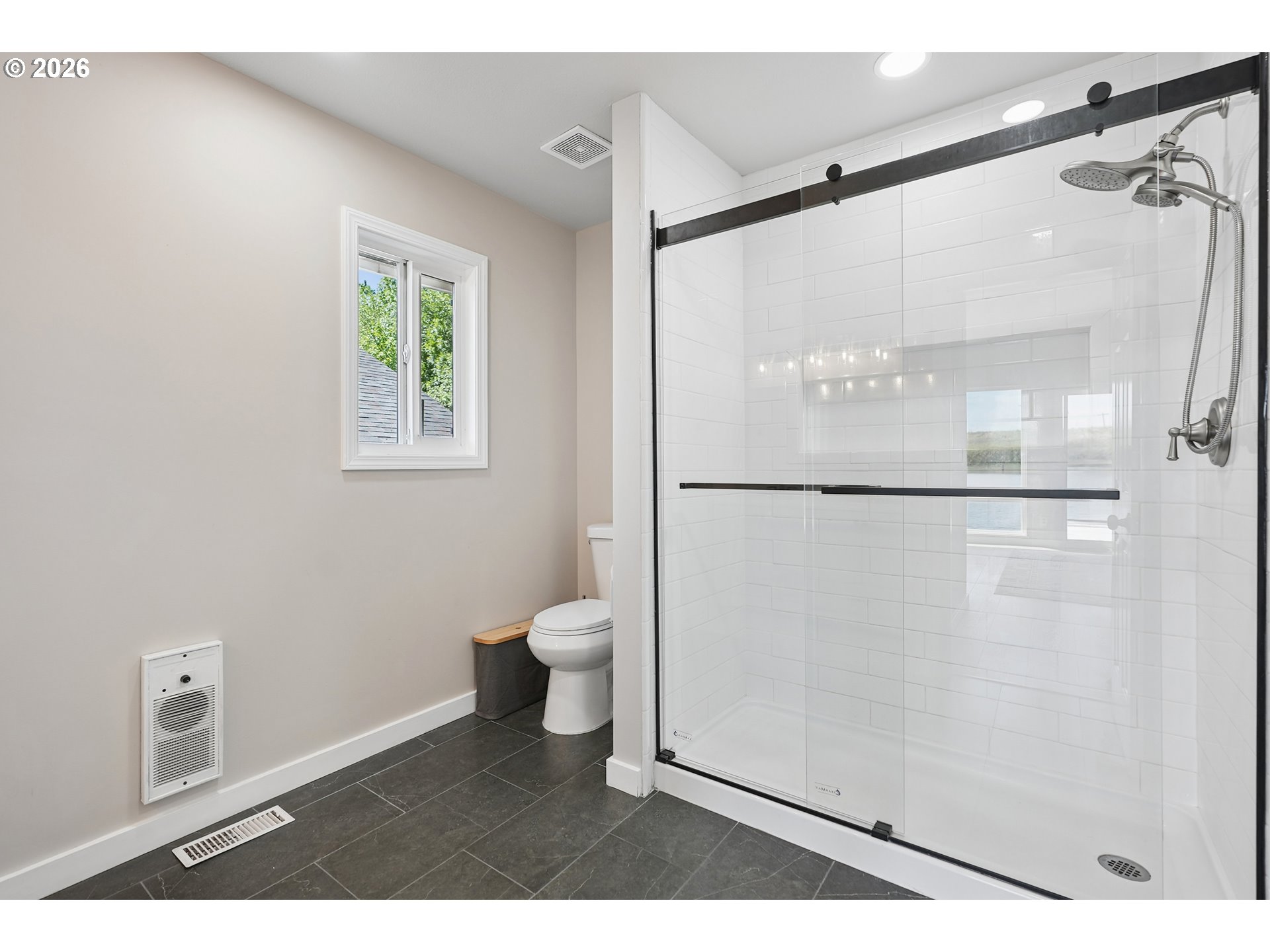 14936 Northwest Mill Road, Unit K Portland, OR 97231 - Photo 19 of 33 a bathroom with a shower and a toilet