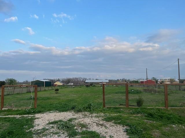 5102 Turnersville Road Creedmoor, TX 78610 - Photo 1 of 5 View of yard with a view of countryside