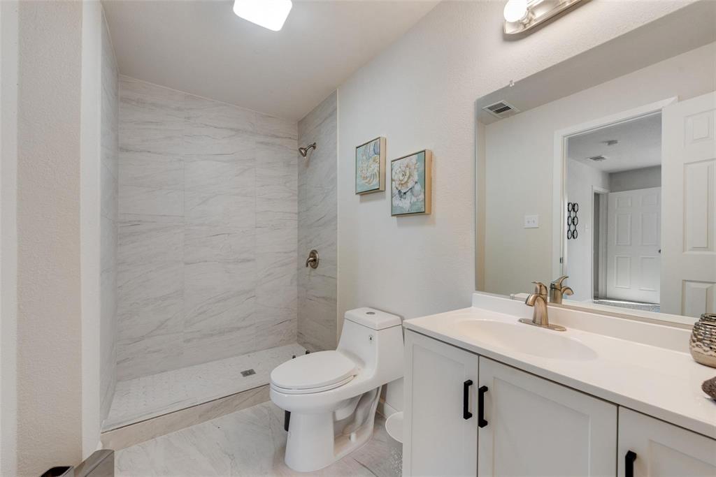 506 North Fm 156 Ponder, TX 76259 - Photo 15 of 23 a bathroom with a sink a toilet and shower