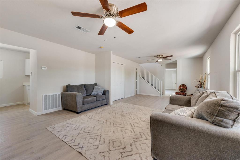 506 North Fm 156 Ponder, TX 76259 - Photo 4 of 23 a living room with furniture and a ceiling fan