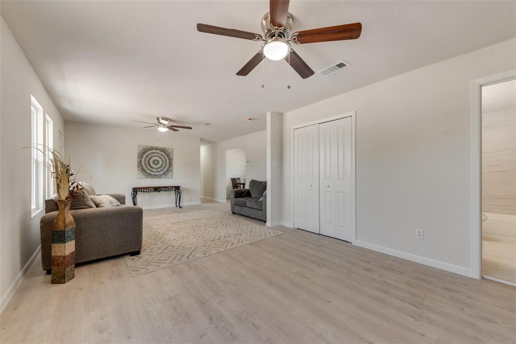506 North Fm 156 Ponder, TX 76259 - Photo 7 of 23 a view of a livingroom with furniture a ceiling fan and windows