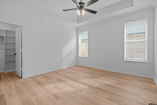 a bedroom with a bed and a chair