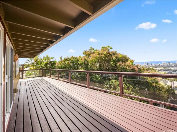 a view of balcony with wooden floor