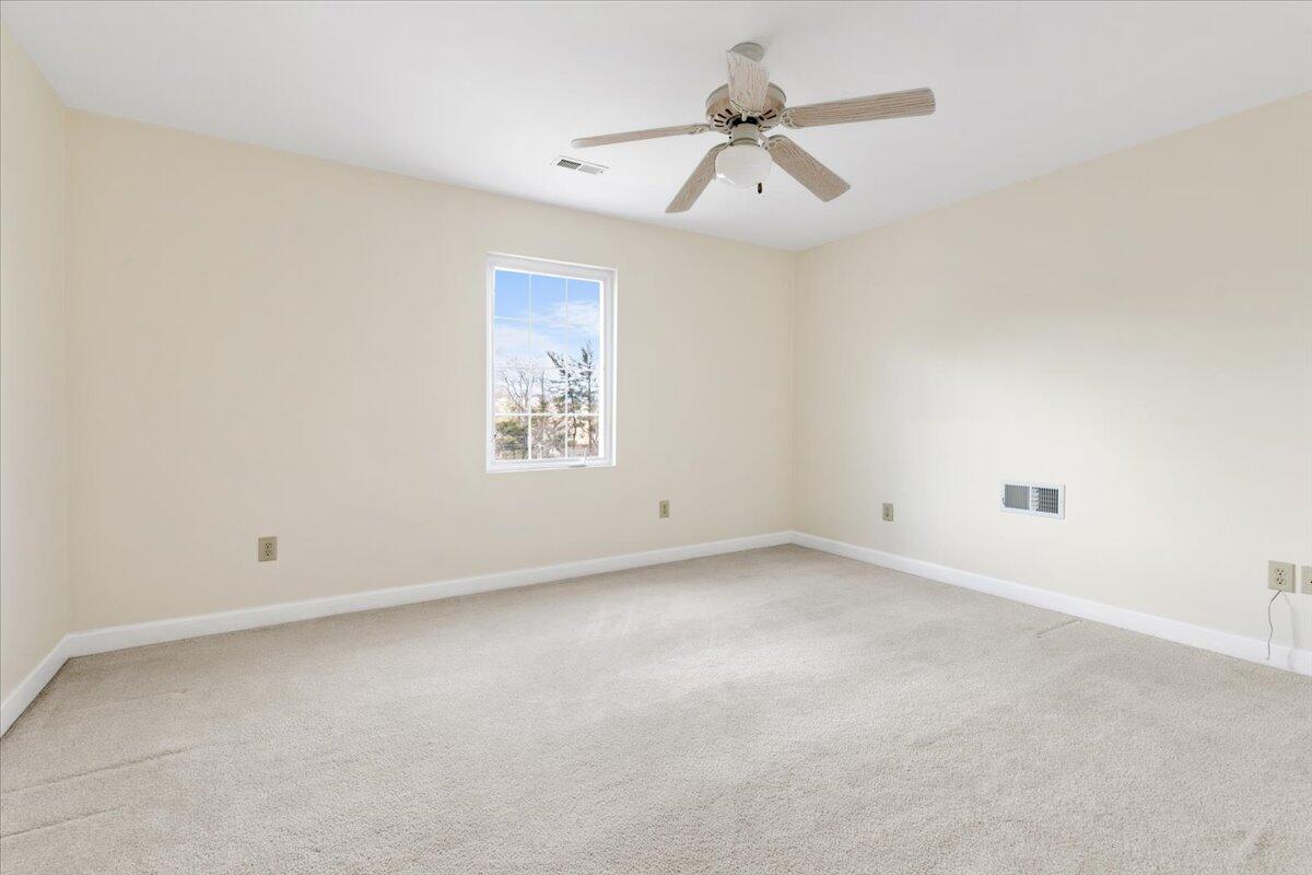 3409 Laurel Circle Roanoke, VA 24018 - Photo 13 of 34 an empty room with a empty space and a ceiling fan