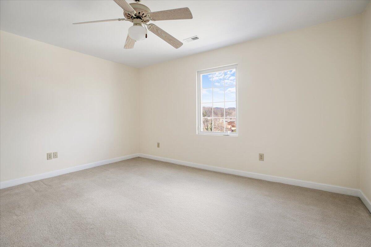 3409 Laurel Circle Roanoke, VA 24018 - Photo 15 of 34 an empty room with a window and a fan