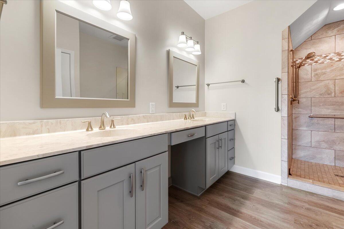 3409 Laurel Circle Roanoke, VA 24018 - Photo 30 of 34 a bathroom with a double vanity sink and a mirror