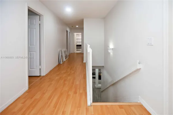 a view of a living room with a wooden floor