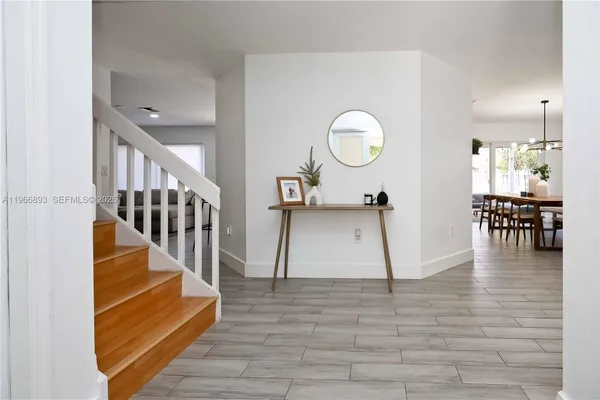 a view of a living room and wooden floor