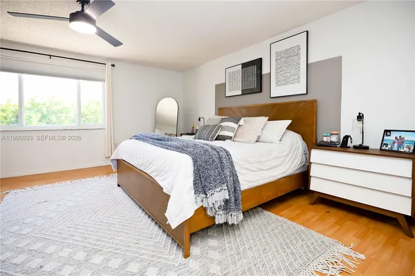 a bed room with a bed and a window