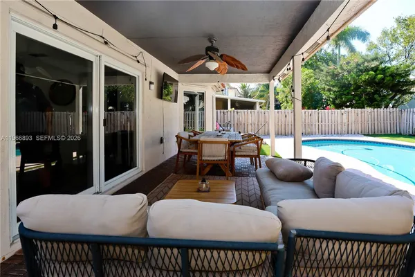 a outdoor space with patio couches and a table