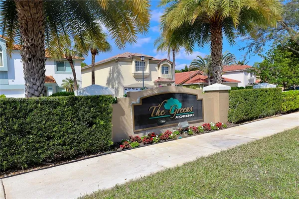 a front view of house with small garden and entertaining space