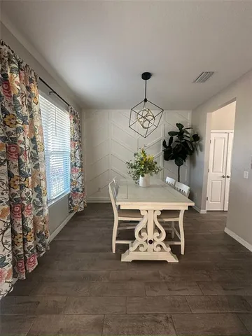 a bathroom with a double vanity sink toilet mirror and shower