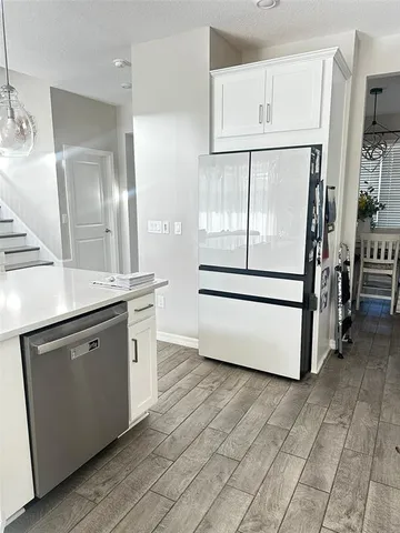 a view of a house with backyard porch and sitting area