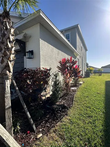 a kitchen with granite countertop white cabinets stainless steel appliances and sink