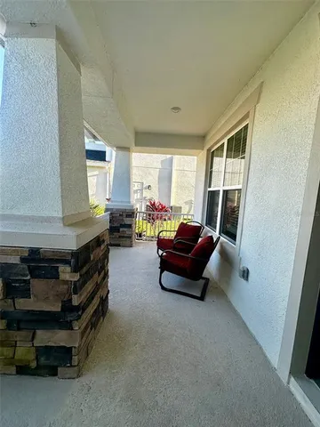 a kitchen with stainless steel appliances kitchen island granite countertop a stove a sink dishwasher and white cabinets with wooden floor