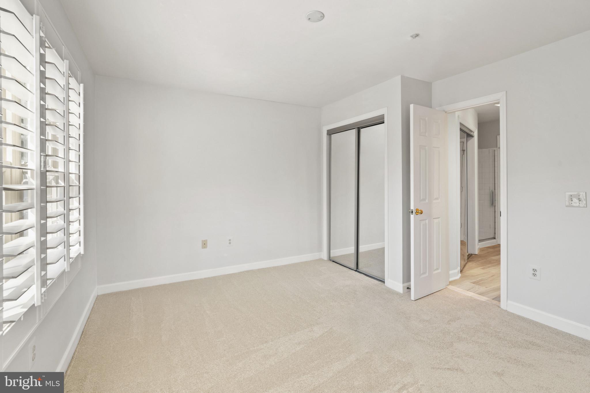 6832 Hayley Ridge Way, Unit D Baltimore, MD 21209 - Photo 12 of 33 a view of an empty room with a window