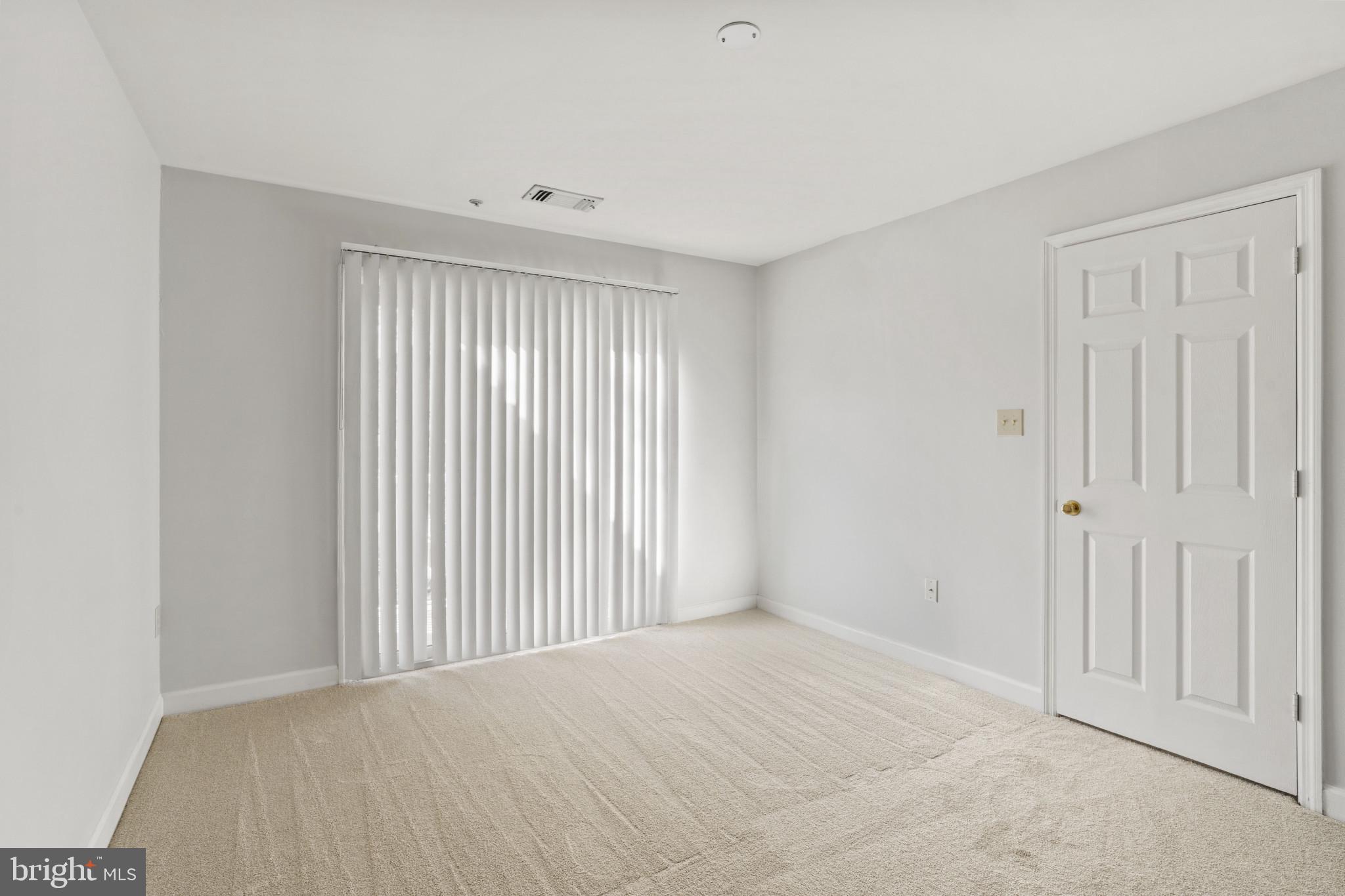6832 Hayley Ridge Way, Unit D Baltimore, MD 21209 - Photo 20 of 33 a view of an empty room with a window