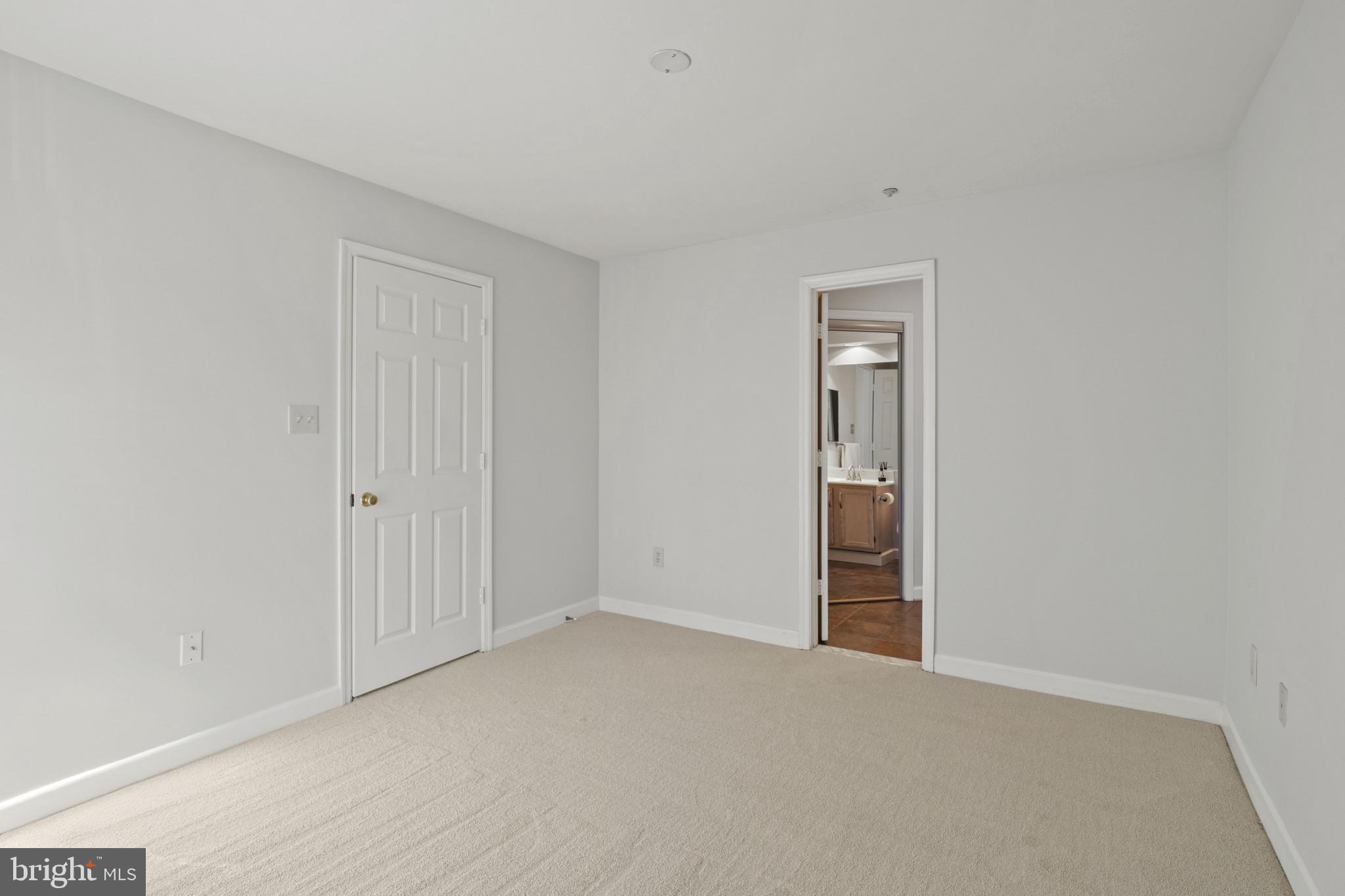 6832 Hayley Ridge Way, Unit D Baltimore, MD 21209 - Photo 21 of 33 a view of an empty room and closet area