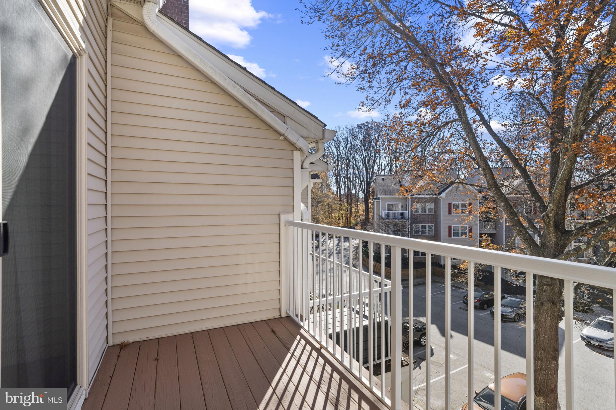 6832 Hayley Ridge Way, Unit D Baltimore, MD 21209 - Photo 29 of 33 a view of a wooden deck