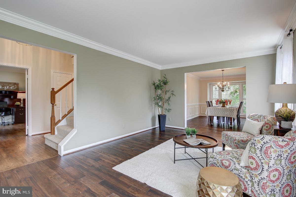 8167 Barnwood Road Manassas, VA 20110 - Photo 5 of 50 Living Room opens to Dining Room for Entertaining