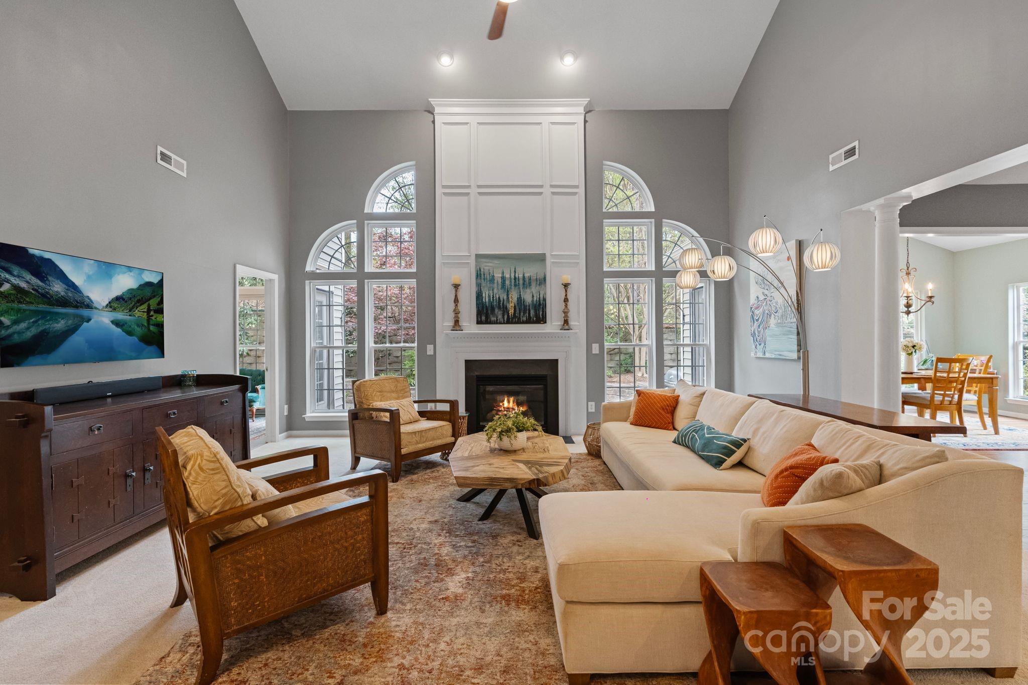 1039 Sharon Lee Avenue Fort Mill, SC 29708 - Photo 14 of 46 a living room with furniture a large window and a fireplace