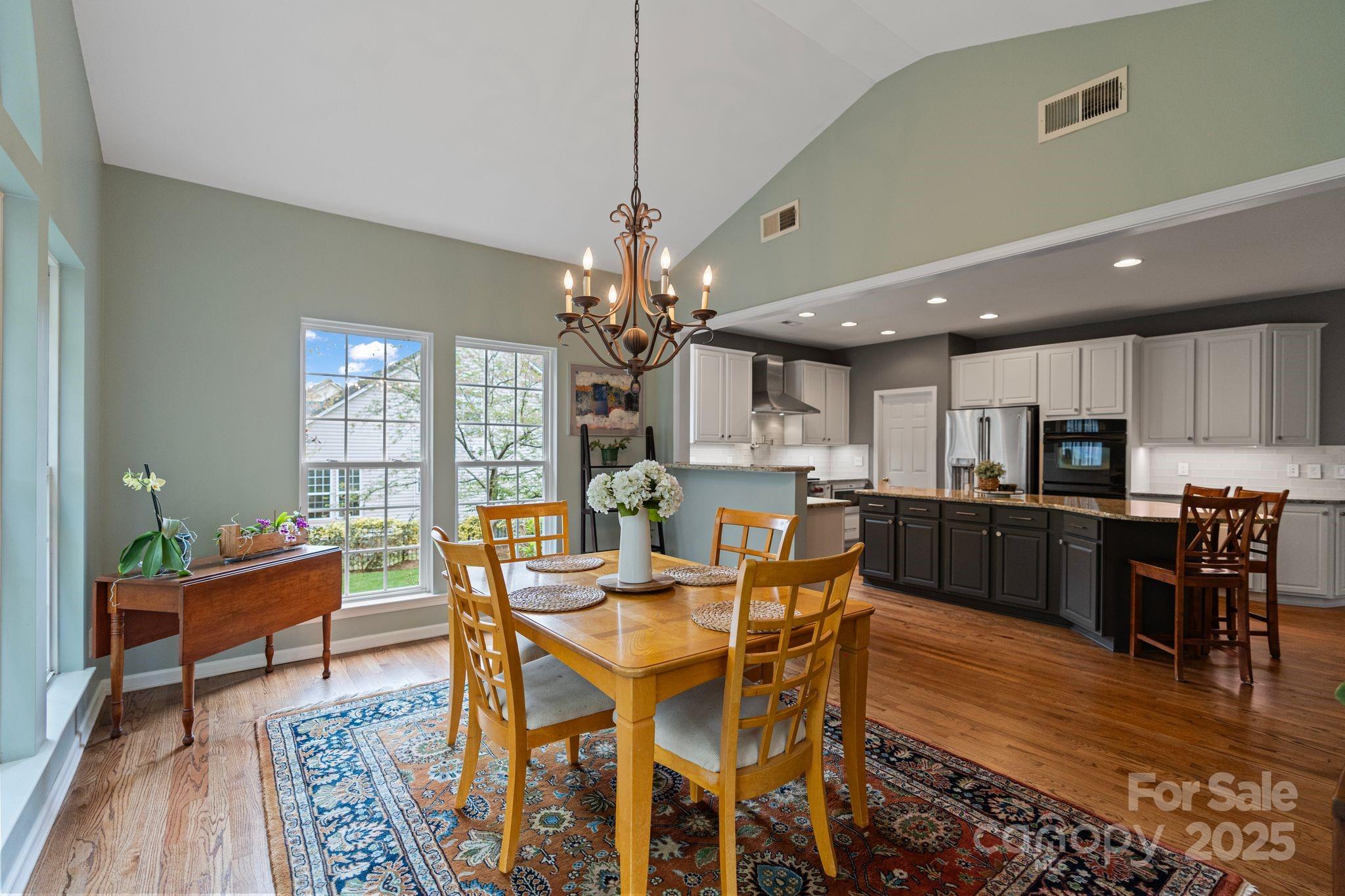 1039 Sharon Lee Avenue Fort Mill, SC 29708 - Photo 21 of 46 a view of a dining room with furniture window and wooden floor