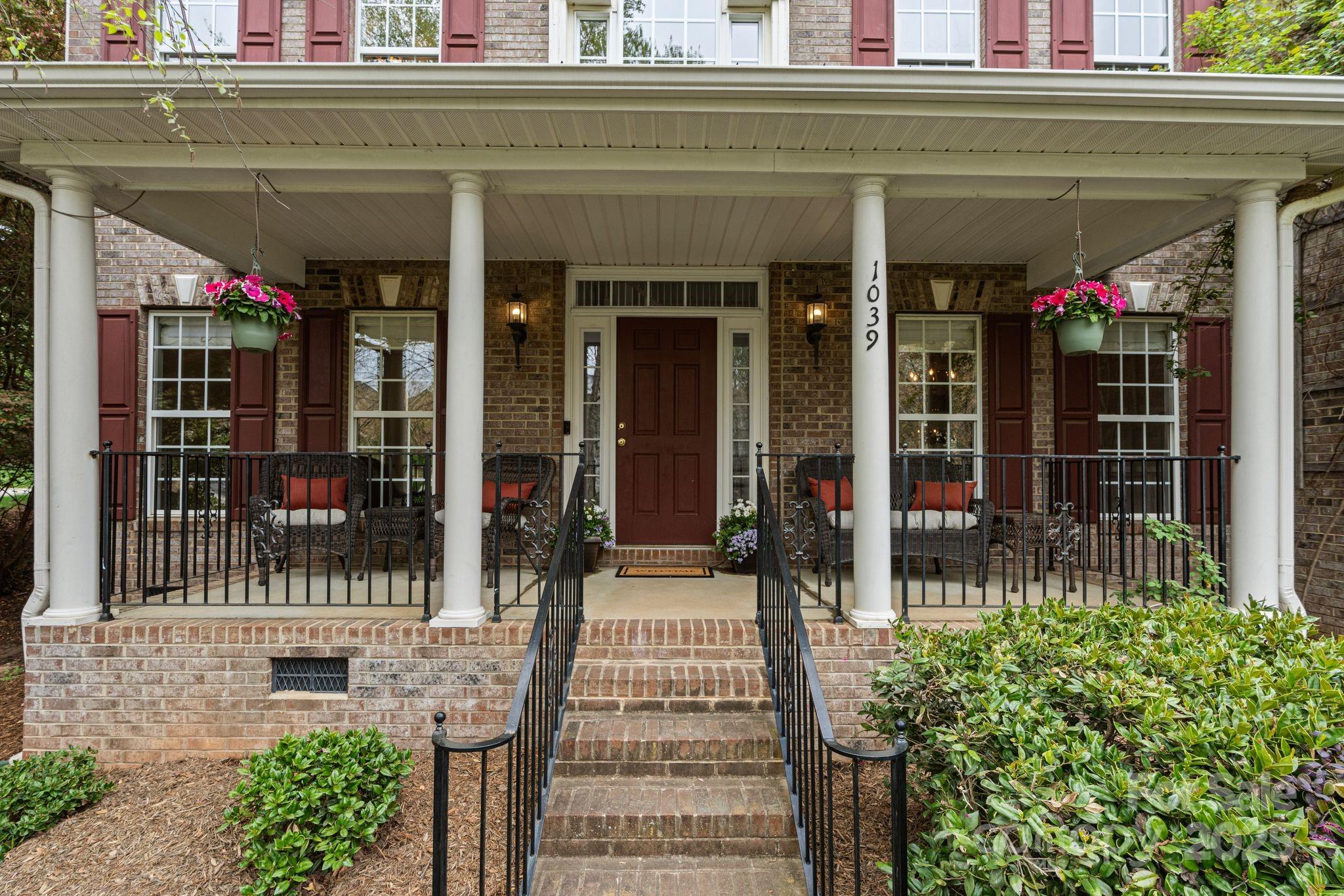 1039 Sharon Lee Avenue Fort Mill, SC 29708 - Photo 3 of 46 a front view of a building with a porch
