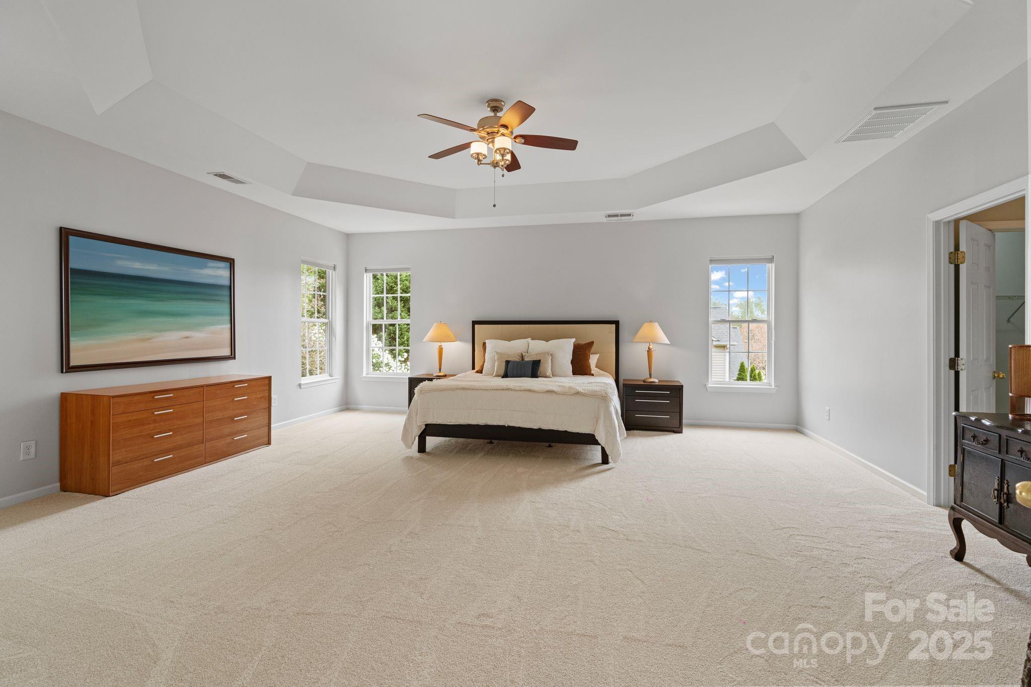 1039 Sharon Lee Avenue Fort Mill, SC 29708 - Photo 33 of 46 a spacious bedroom with a bed and a flat screen tv