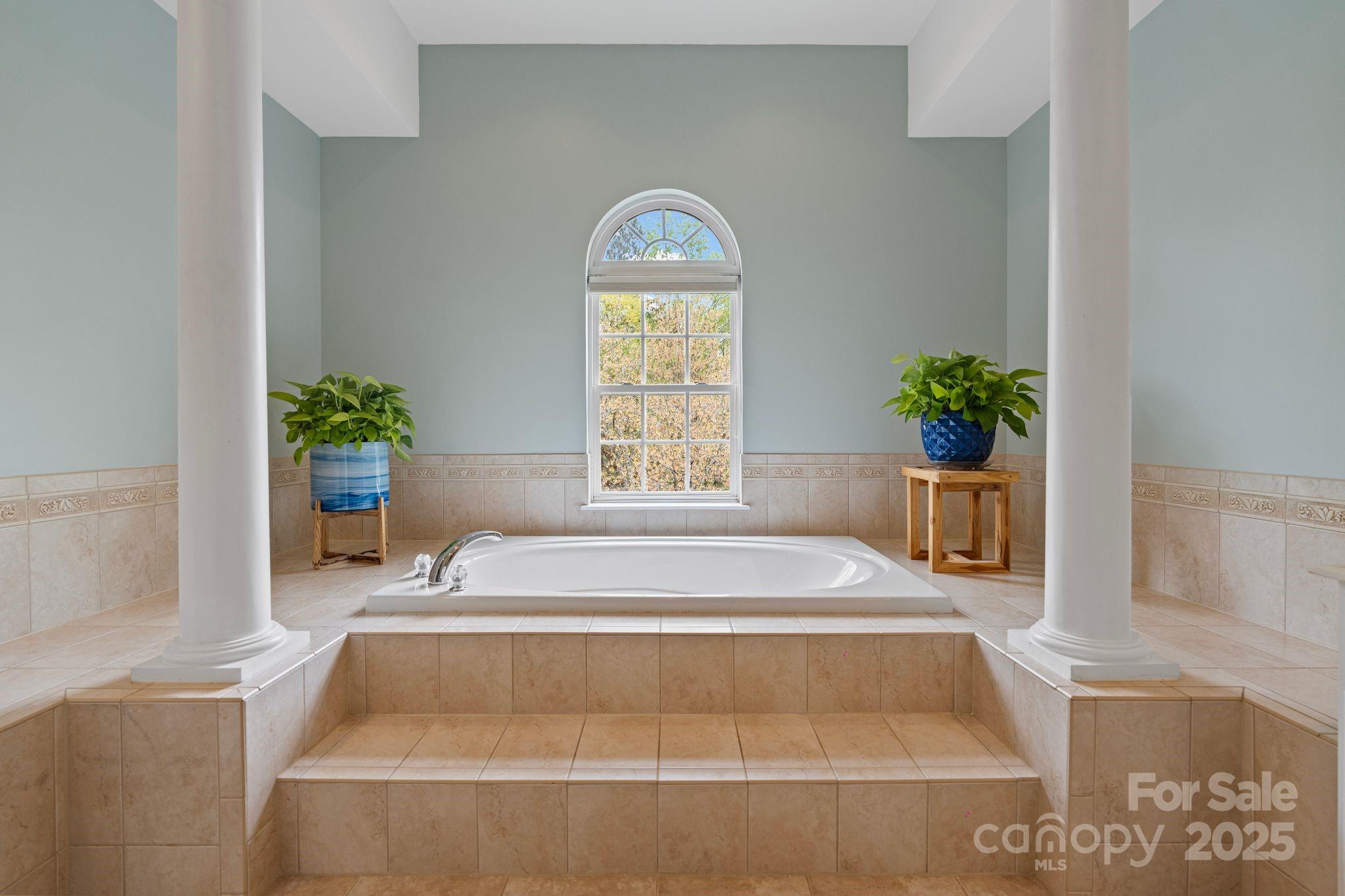 1039 Sharon Lee Avenue Fort Mill, SC 29708 - Photo 37 of 46 a spacious bedroom with a bed and a window