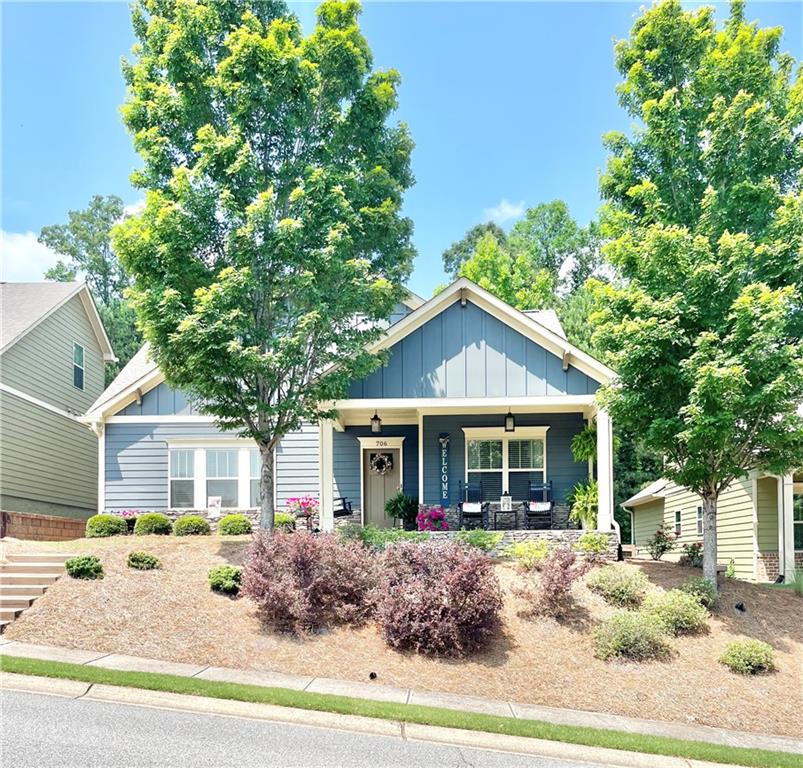a front view of a house with garden