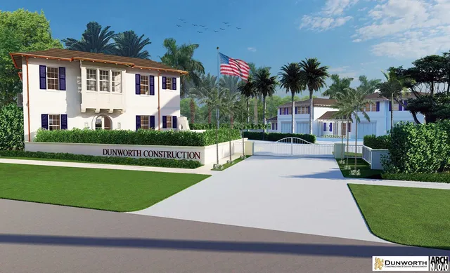 a white house with a yard and plants