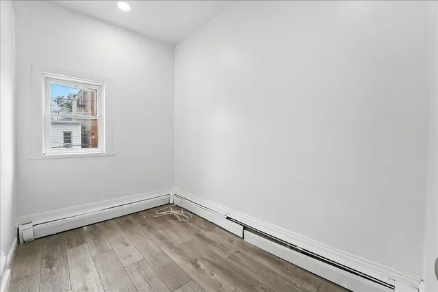 a view of a hallway with a window